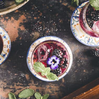 Blackberry mojitos on a tray.