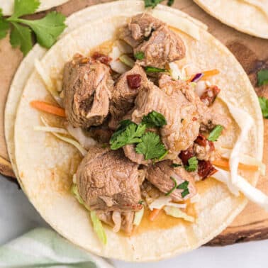 This tender Braised Pork Shoulder is slow-roasted and marinated in dark beer and aromatic herbs, then combined with caramelized onions and a kick of chipotle.