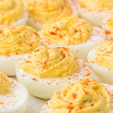 closeup of deviled eggs with paprika.