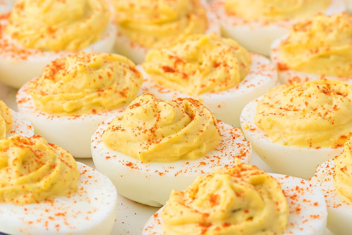 closeup of deviled eggs with paprika.