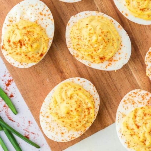 overhead of deviled eggs on a board.