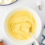 egg yolks mashed in a bowl.