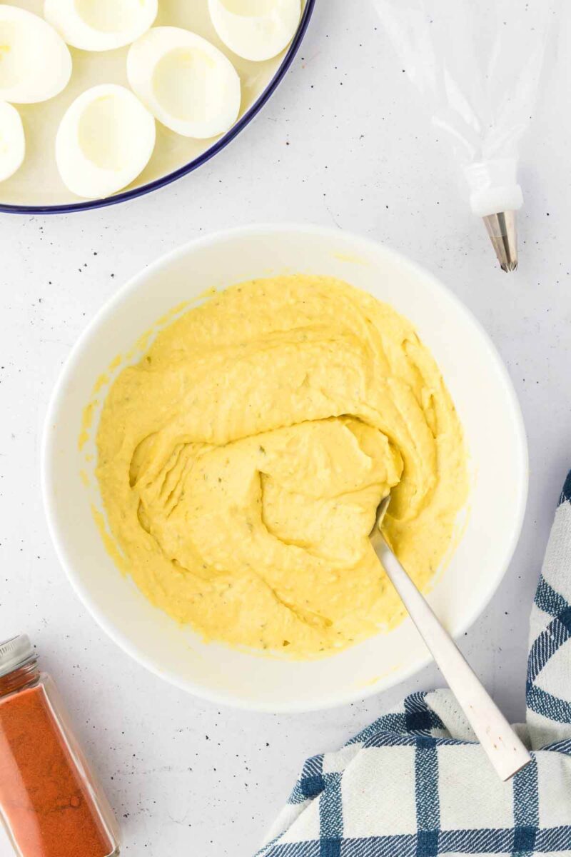 egg yolks mashed in a bowl.