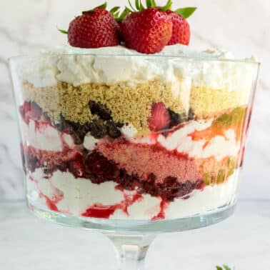 This Strawberry Trifle Recipe blends ripe strawberries, tart raspberries, rich chocolate, and fluffy whipped cream into a fabulous and easy dessert.
