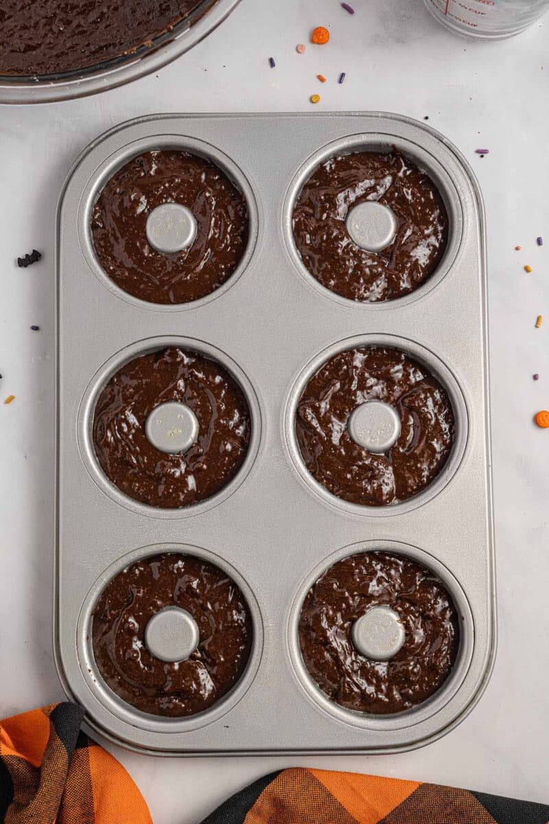 A donut pan filled with batter.