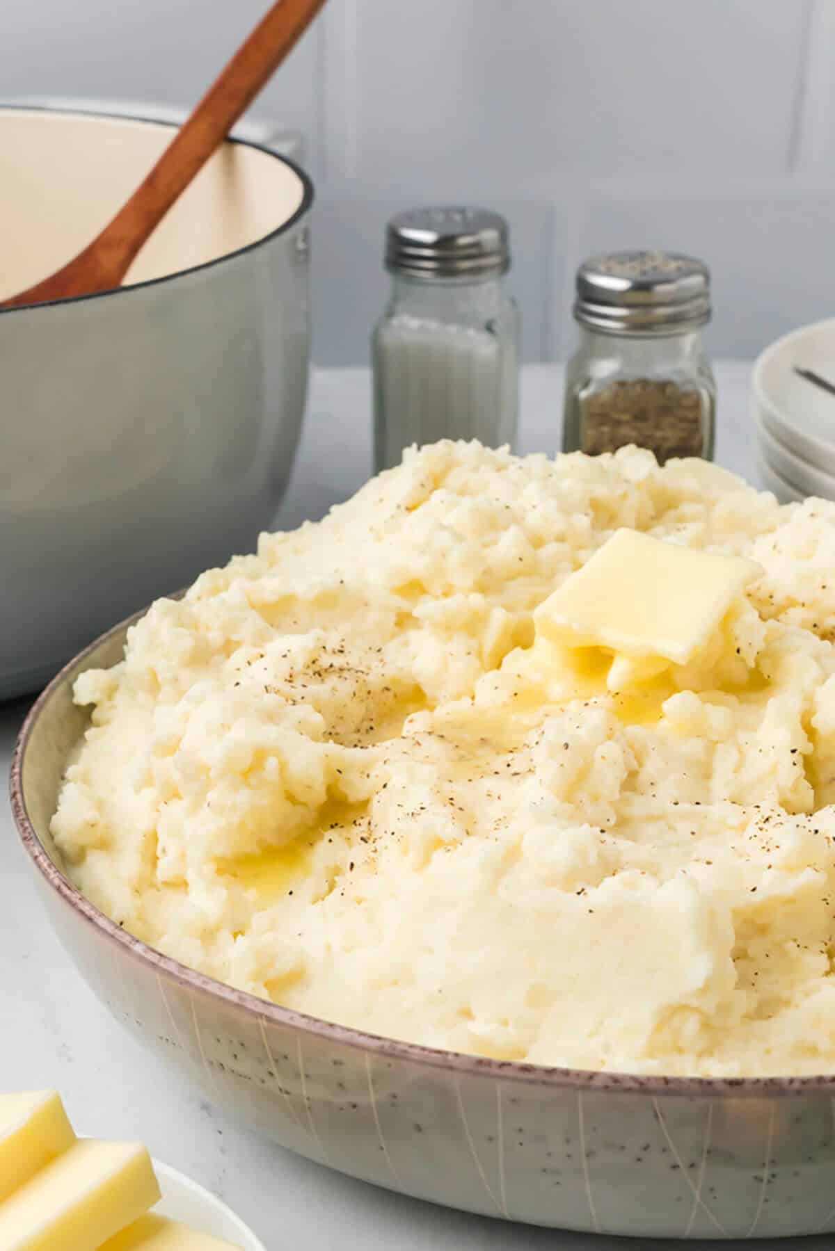 A bowl of Southern mashed potatoes topped with butter.