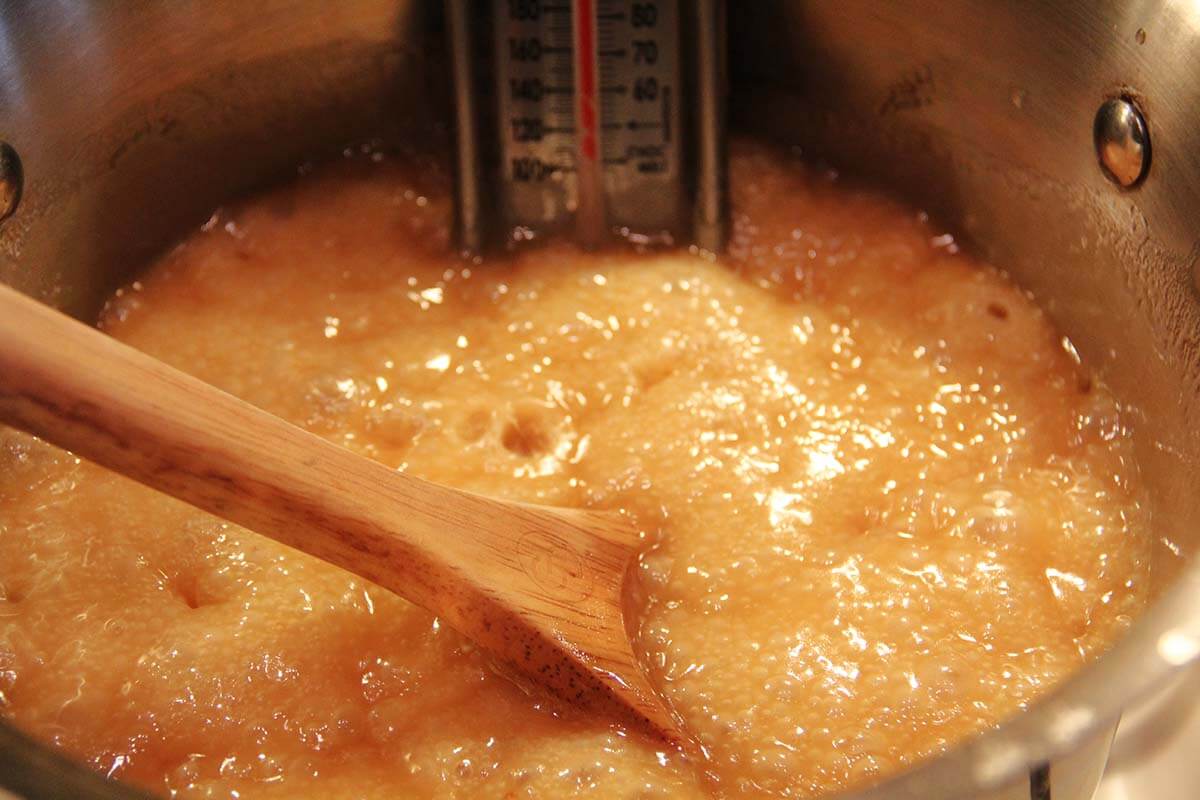 A pot of sugar and butter cooking. 