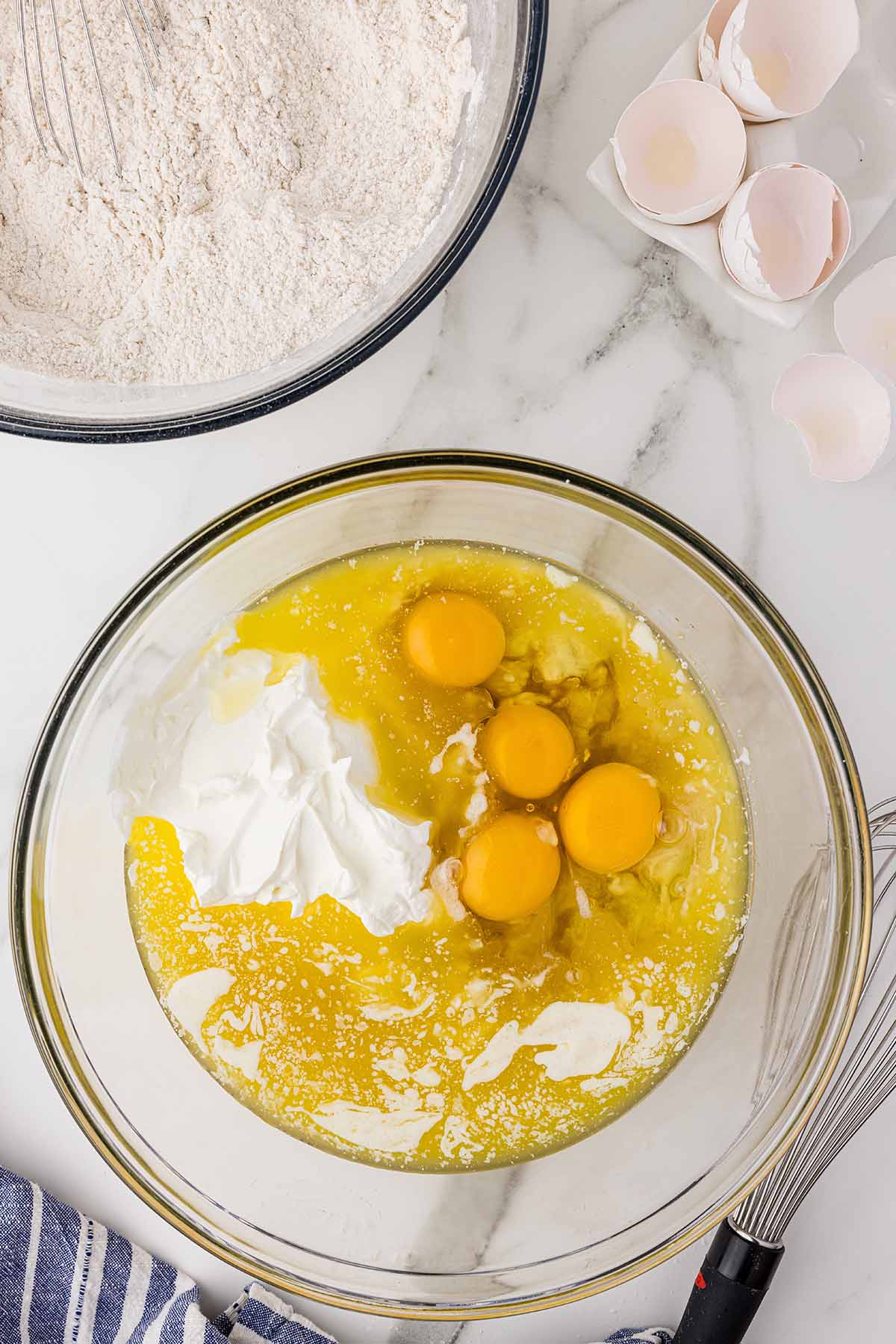 Eggs and sugar in a bowl.