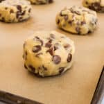 Round balls of cookie dough on parchment paper