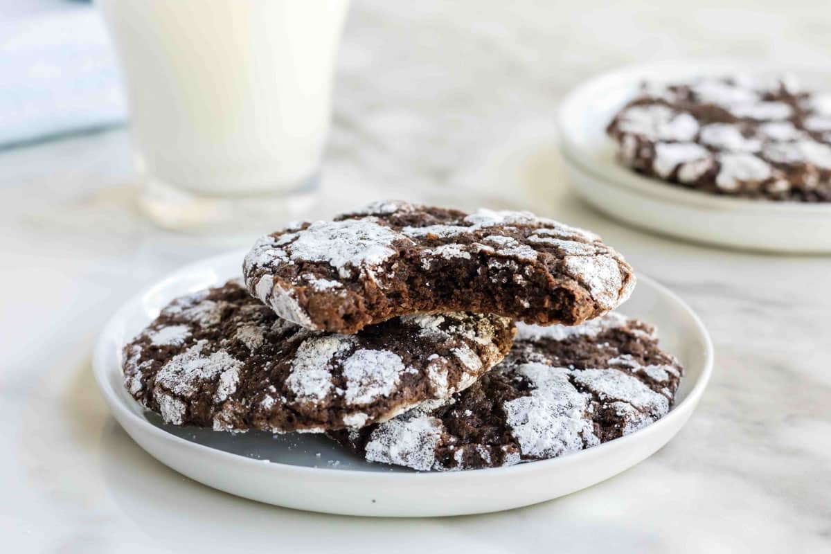 Chocolate crinkle cookie on a white plate. 