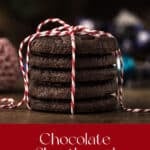 A stack of chocolate shortbread cookies tied with red and white string.