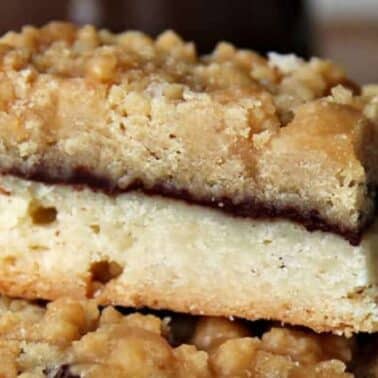 A shortbread bar with a cream filling and a thin layer of chocolate.