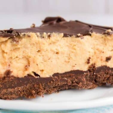 A slice of chocolate peanut butter pie on a white plate.