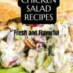 Close-up of a chicken salad sandwich with lettuce and red grapes, topped with a creamy dressing. Text overlay reads "17 Chicken Salad Recipes - Fresh and Flavorful.