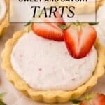 A tart with creamy filling topped with sliced strawberries sits on parchment paper, surrounded by other similar tarts. Text overlay reads “13 Sweet and Savory Tarts.”.