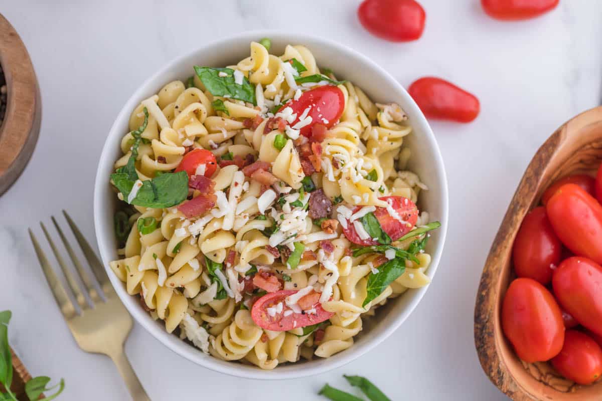 Chicken bacon pasta salad with crispy bacon, cheddar, tomatoes, and herbs—fresh, bold, and no mayo.
