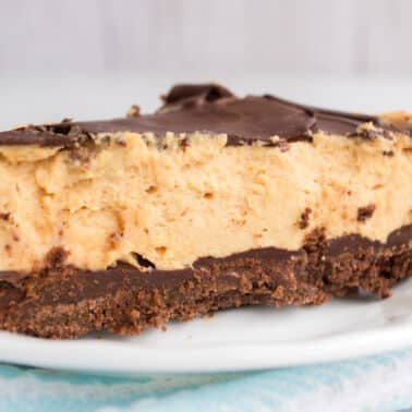 A slice of chocolate peanut butter pie on a white plate. 