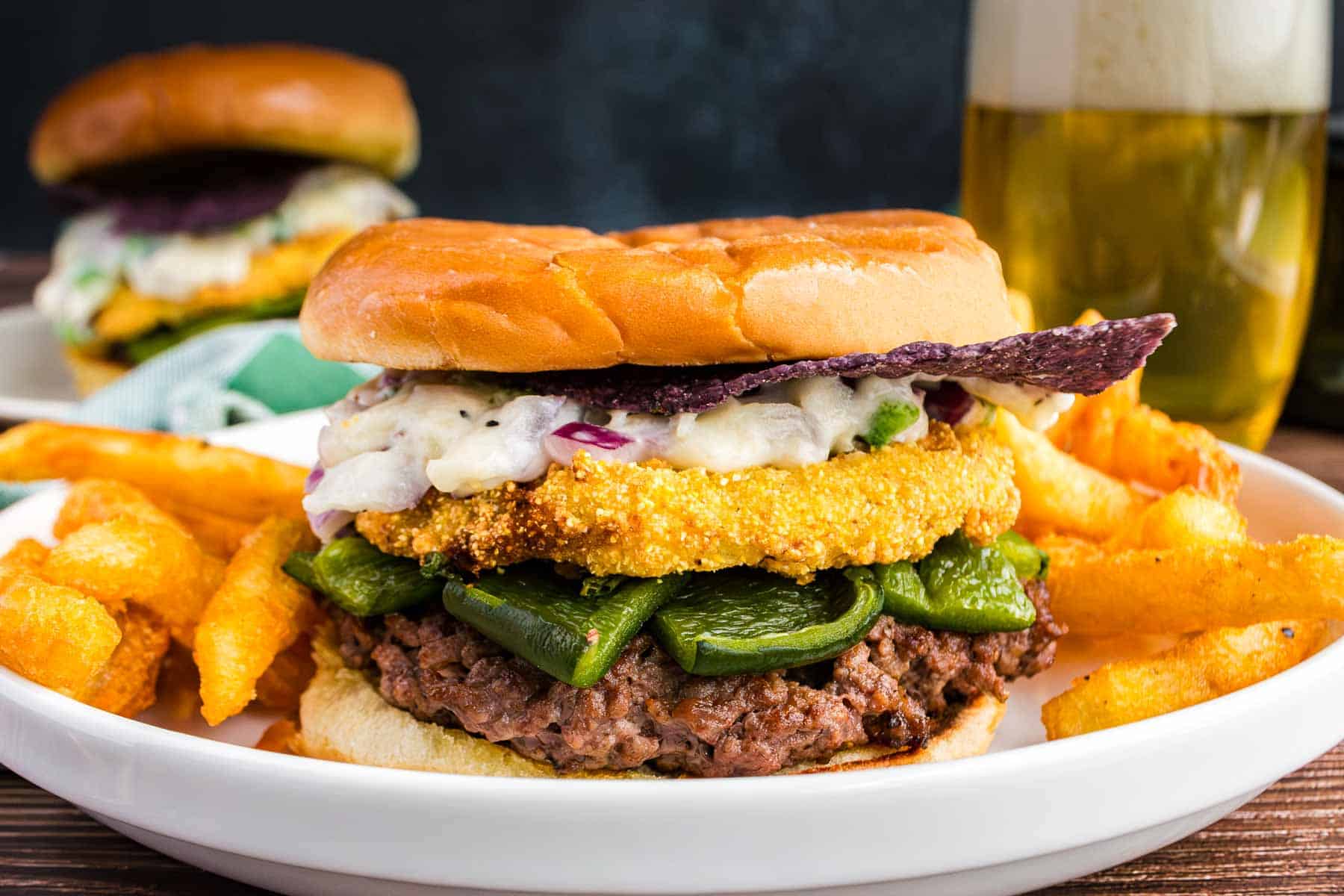 Santa Fe Burger with poblano peppers, queso, and fried green tomato—bold flavor in every bite.