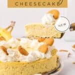 A slice of banana pudding cheesecake topped with whipped cream and vanilla wafers is being lifted from a whole cheesecake. Text reads “Banana Pudding Cheesecake” and “NEW.”.