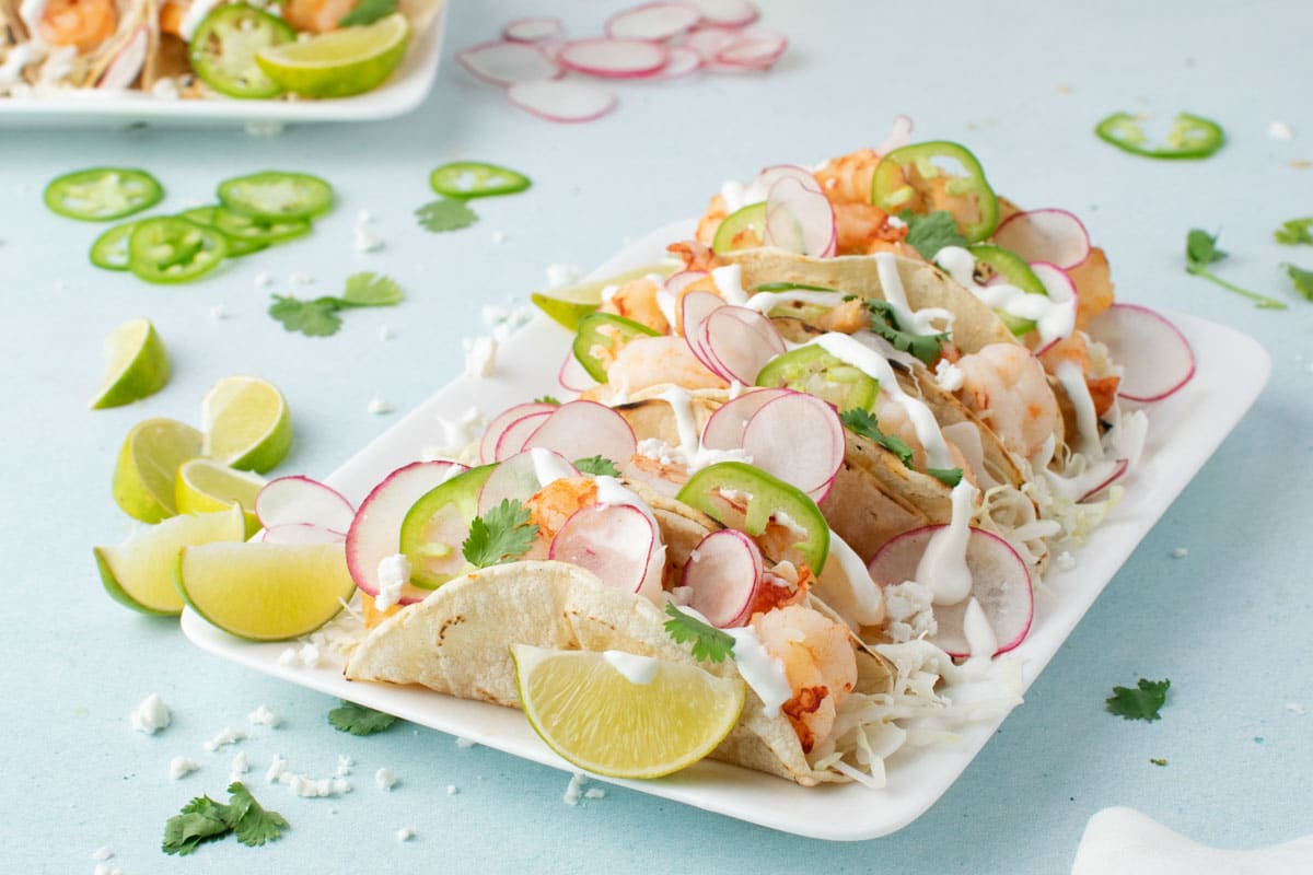 Fresh and vibrant, these Baha Shrimp Tacos are packed with juicy shrimp, crisp cabbage, 