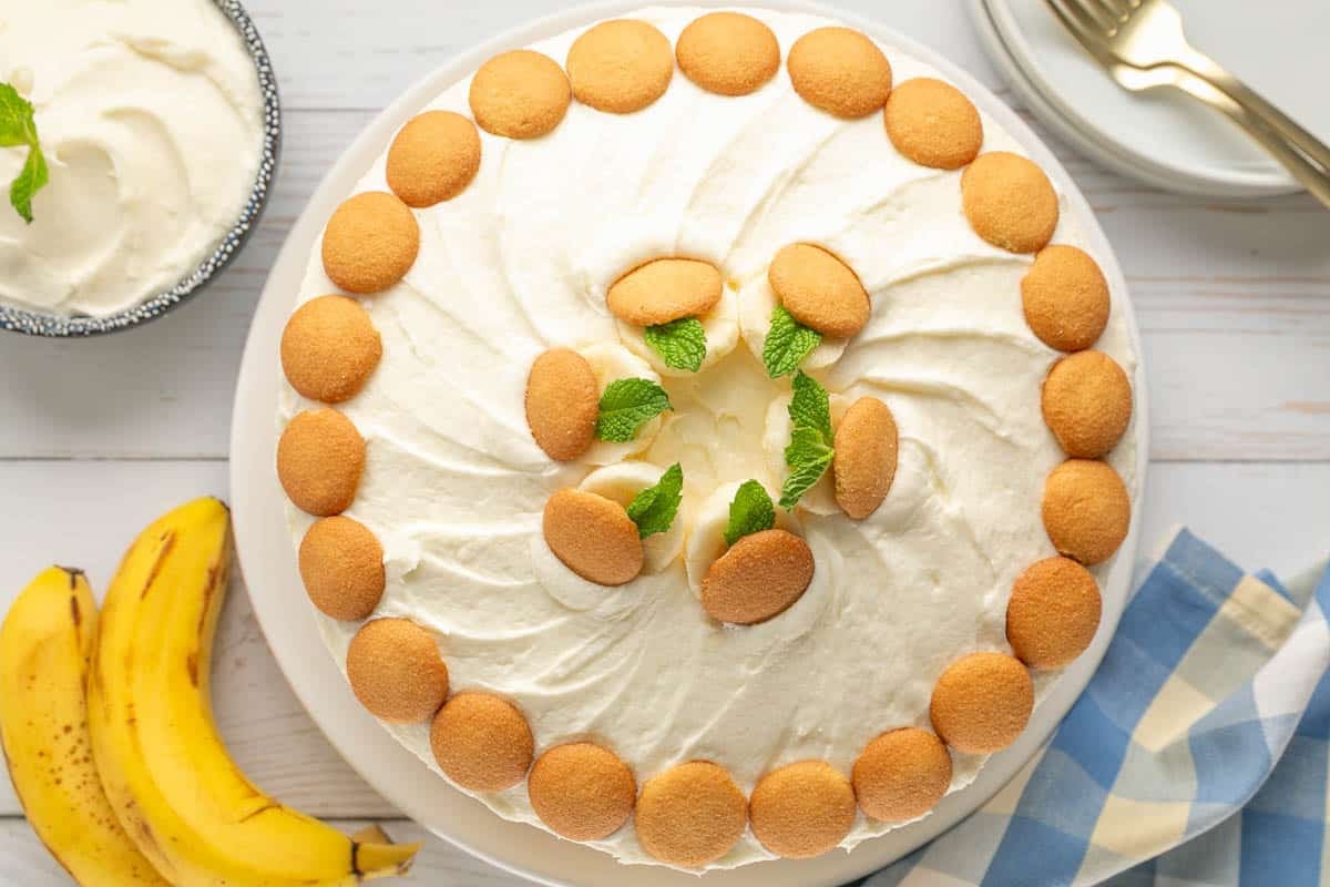 This Banana Pudding Cake blends rich banana flavor, creamy filling, and fluffy frosting