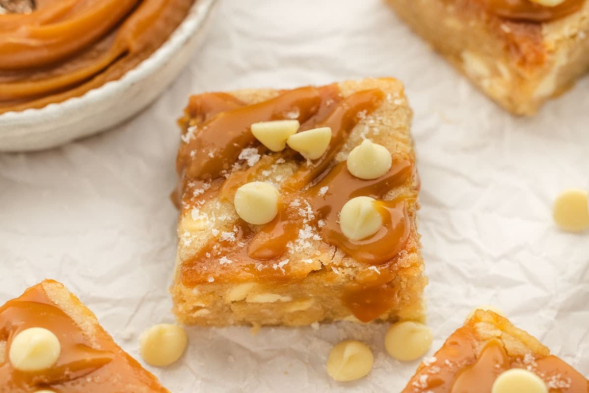Chewy blondies swirled with salted caramel and white chocolate, topped with a sprinkle of flaky sea 