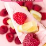 A slice of raspberry dessert topped with fresh raspberries and lemon pieces, with more raspberries in the background. Text reads "13 Raspberry Desserts.