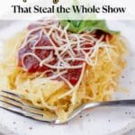 A plate of spaghetti squash topped with tomato sauce, shredded cheese, and basil, with a fork on the side. Text reads: "20 Air Fryer Side Dishes That Steal the Whole Show.