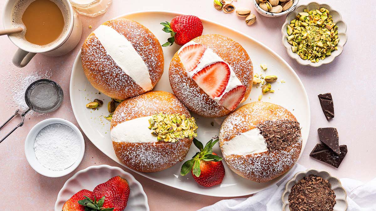 A plate of pastries with strawberries and pistachios—perfect for make ahead breakfasts or breakfast meal prep.