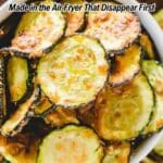 A bowl of air-fried zucchini chips with overlaid text reading "11 Appetizers Made in the Air Fryer That Disappear First.