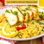 A plate of orzo pasta with grilled chicken slices, garnished with parsley and lemon, set on a red-and-white cloth; text reads "11 Budget Dinners That Stretch Without Feeling Cheap.