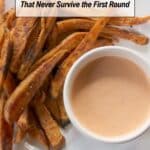 A plate of crispy fries next to a small bowl of dipping sauce, with text reading "11 Fries That Never Survive the First Round.
