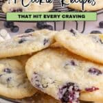 A plate of homemade blueberry cookies with sugar on top sits in front of a rack of more cookies. Text reads: "14 Cookie Recipes That Hit Every Craving.