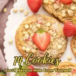 White chocolate chip cookies topped with fresh strawberries are arranged on a white platter, with whole strawberries placed nearby. Text overlay reads, “14 Cookies You’ll Have to Hide From Yourself.”.