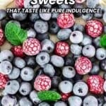 Close-up of a dessert topped with frozen raspberries, blueberries, and fresh mint leaves, with text that reads "14 Vegetarian Sweets That Taste Like Pure Indulgence.