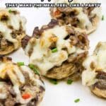 A plate of stuffed mushrooms topped with melted cheese, garnished with chopped chives. Text reads: "15 Appetizers That Make the Meal Feel Like a Party.