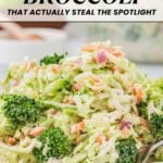 A plate of broccoli slaw salad with shredded carrots and red onions, topped with a creamy dressing, showcases one of the tastiest broccoli recipes, served on a white dish.