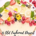 A fruit-topped dessert garnished with strawberries, bananas, raspberries, blueberries, and edible flowers; text reads "15 Old Fashioned Dessert Recipes.