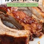 Close-up of cooked ribs served on a white plate, with text overlay reading "16 Oven Dinners That Are Juicy, Crispy, and Flavorful.