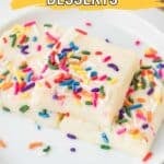 Two square pieces of white chocolate dessert topped with colorful sprinkles are placed on a white plate. Text on the image reads, "16 White Chocolate Desserts.