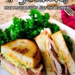 A plate with two halves of a grilled sandwich filled with meat and avocado, served beside a portion of leafy greens, with "17 Sandwiches" text above.