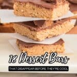 Three chocolate-topped dessert bars stacked on parchment paper, with more dessert bars blurred in the background. Text reads: "18 Dessert Bars That Disappear Before They're Cool.