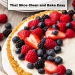 A mixed berry tart with a graham cracker crust and cream filling sits on a plate. Text reads "18 Tart Recipes That Slice Clean and Bake Easy.