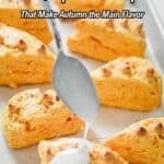 A hand drizzles white icing over freshly baked pumpkin scones arranged on a baking tray. Text reads, "19 Pumpkin Recipes That Make Autumn the Main Flavor.
