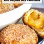 Close-up of golden brown, sugar-coated air fryer pastries with a bowl in the background; one pastry is cut open showing a fruit filling. Text reads, "24 Air Fryer Recipes That Surprise Your Taste Buds.