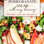 A bowl of apple pomegranate salad with walnuts, feta cheese, arugula, and pomegranate seeds, topped with a light dressing.