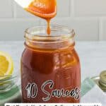 A spoon drizzling orange-brown sauce into a glass jar, with lemon slices and a checkered napkin nearby. Text reads, โ10 Sauces That Elevate Meals From Ordinary to Memorable.โ.