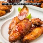 A hand drizzles honey sauce over a plate of cooked chicken wings, with lime wedges and more wings in the background. Text reads, "11 Honey Recipes That Add a Touch of Sweet Comfort.