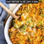 Casserole with broccoli, cheese, and crunchy topping in a white dish with a wooden spoon. Text reads: "13 Broccoli Dishes That Refuse to Be Just a Side.