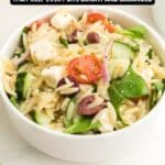 A bowl of orzo salad with cherry tomatoes, cucumbers, red onion, feta cheese, olives, and greens, with text reading "17 Salad Recipes That Keep Every Bite Bright and Balanced.
